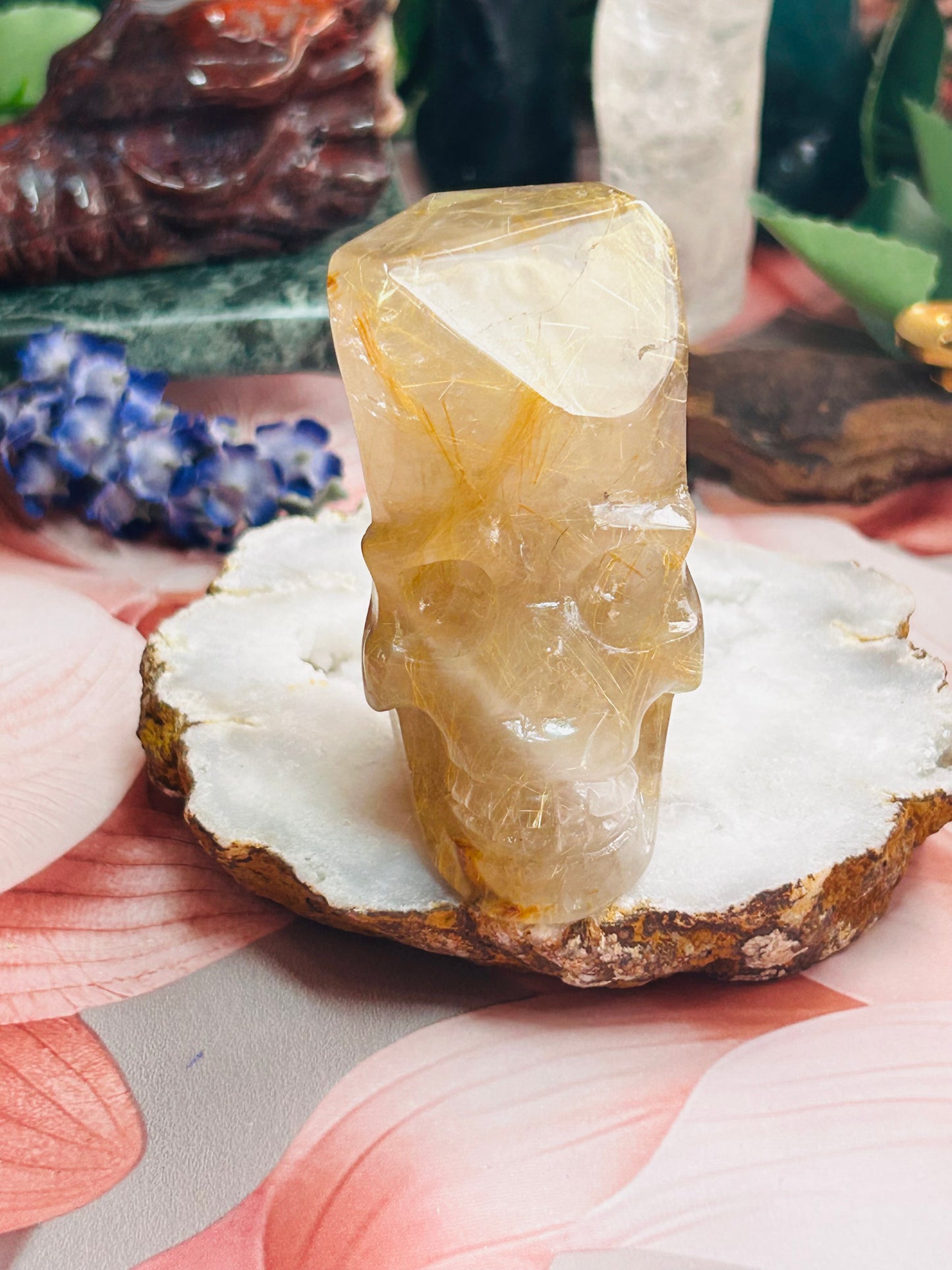 Gold rutilated quartz skull
