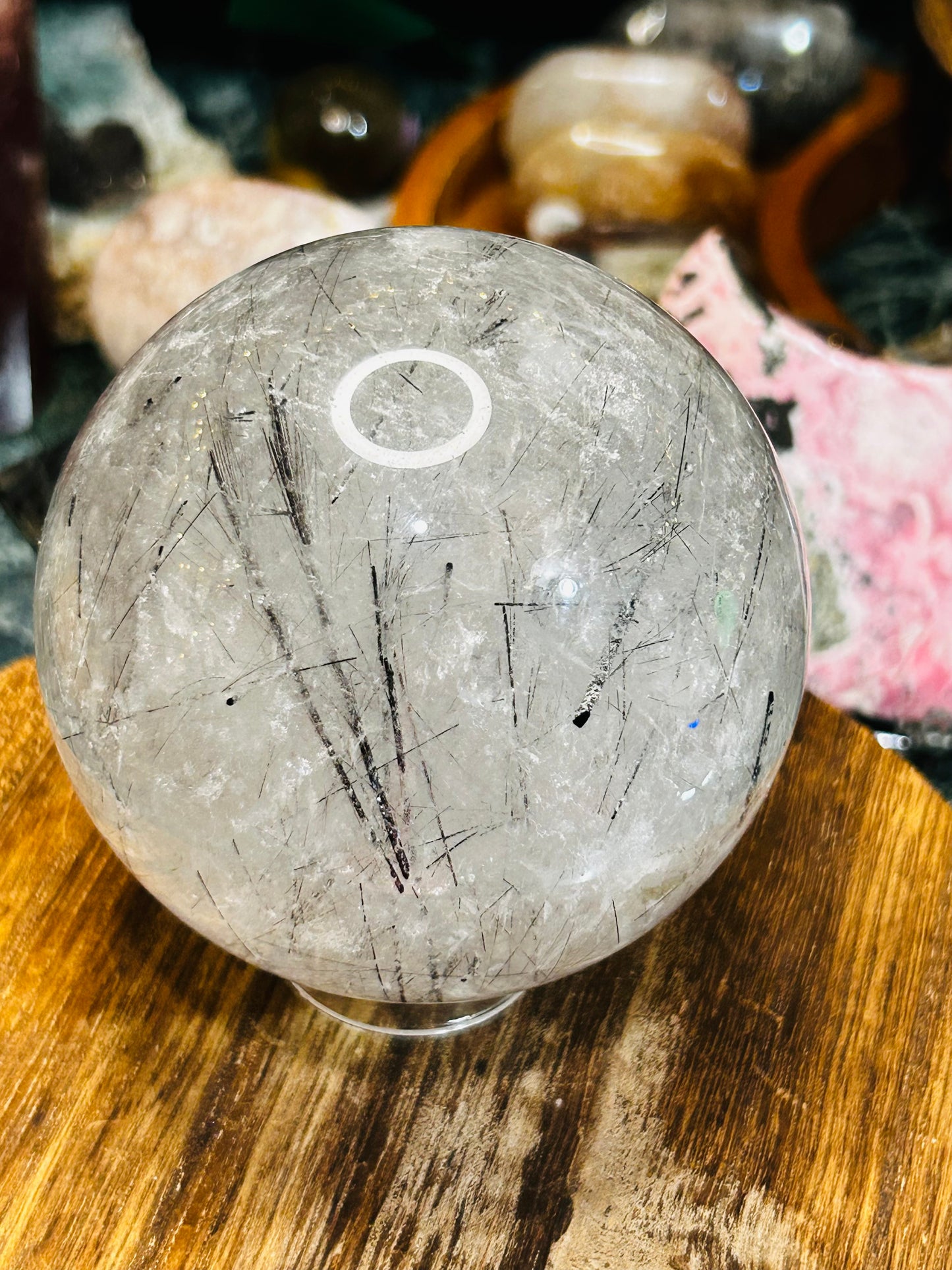Black tourmaline in quartz sphere
