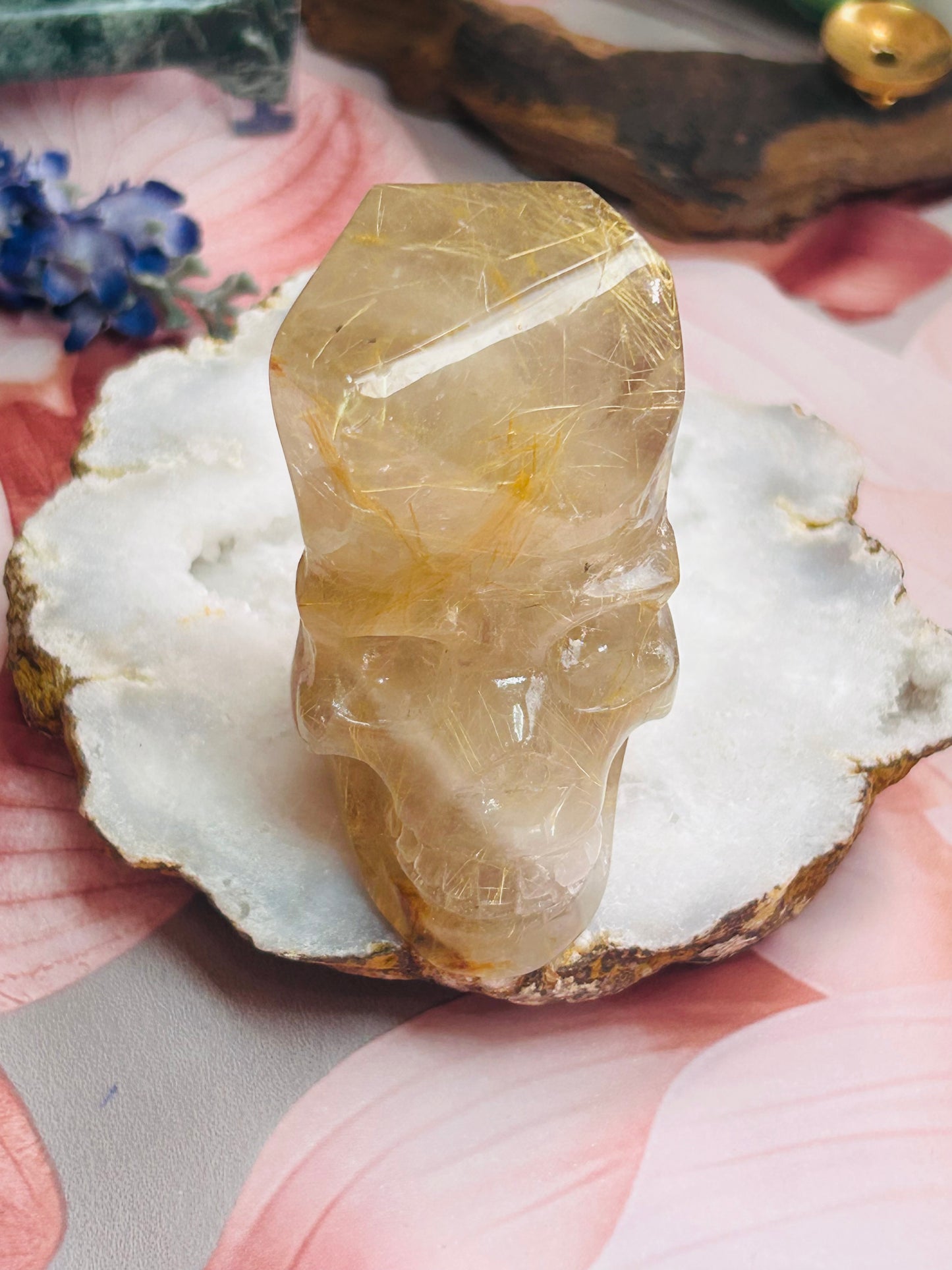 Gold rutilated quartz skull