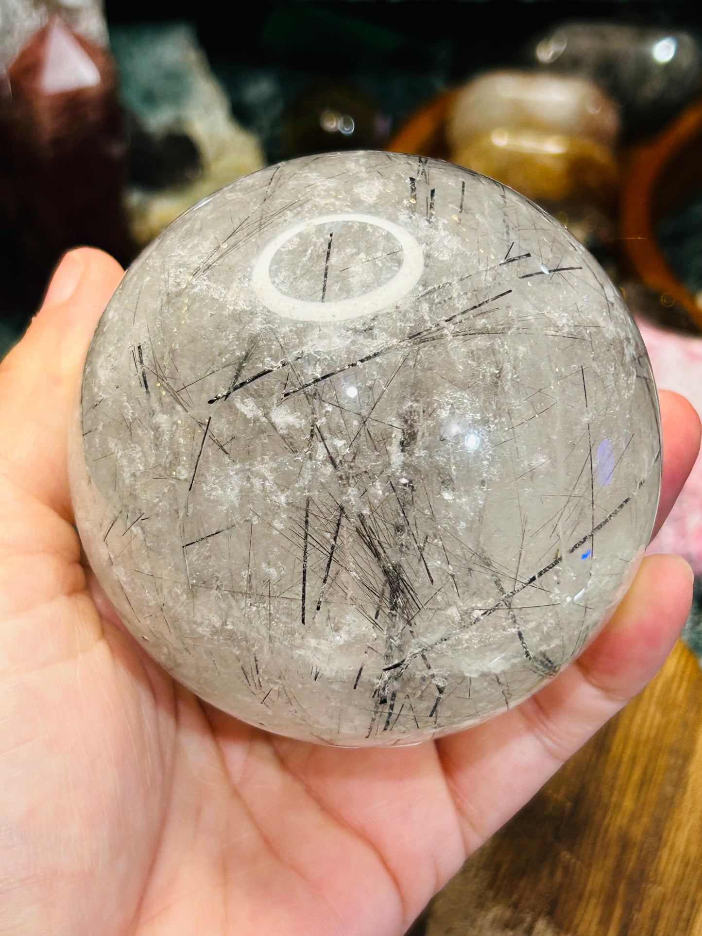 Black tourmaline in quartz sphere
