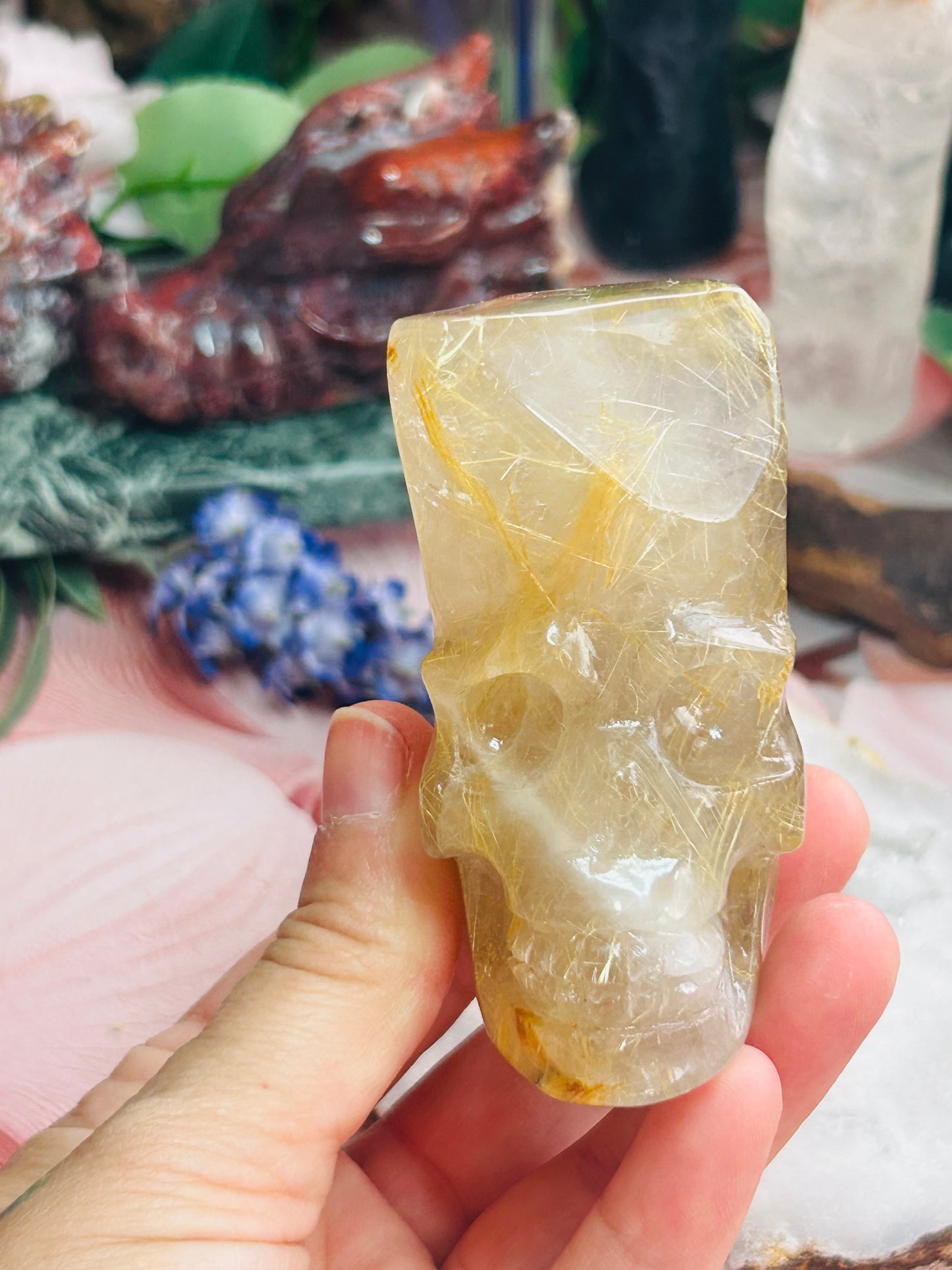 Gold rutilated quartz skull
