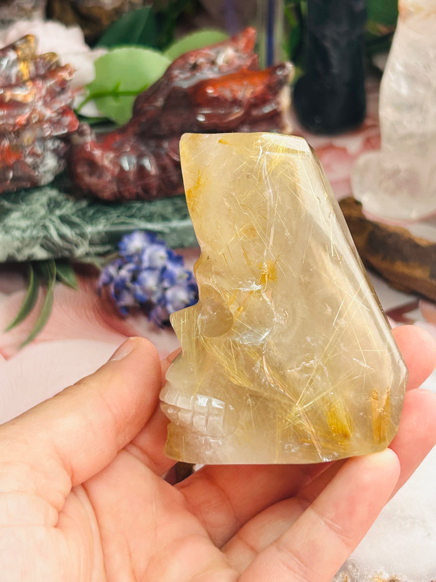 Gold rutilated quartz skull