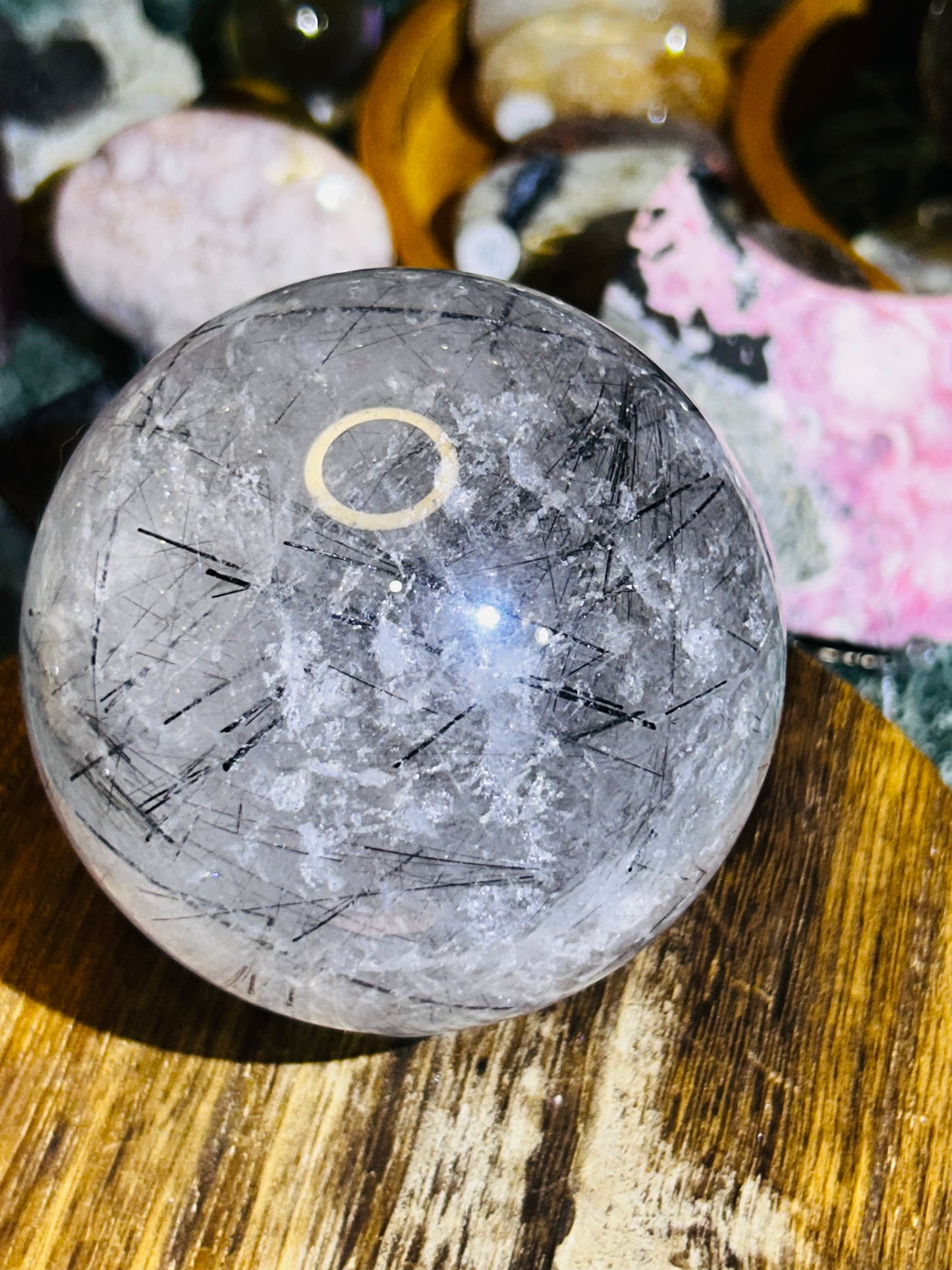 Black tourmaline in quartz sphere