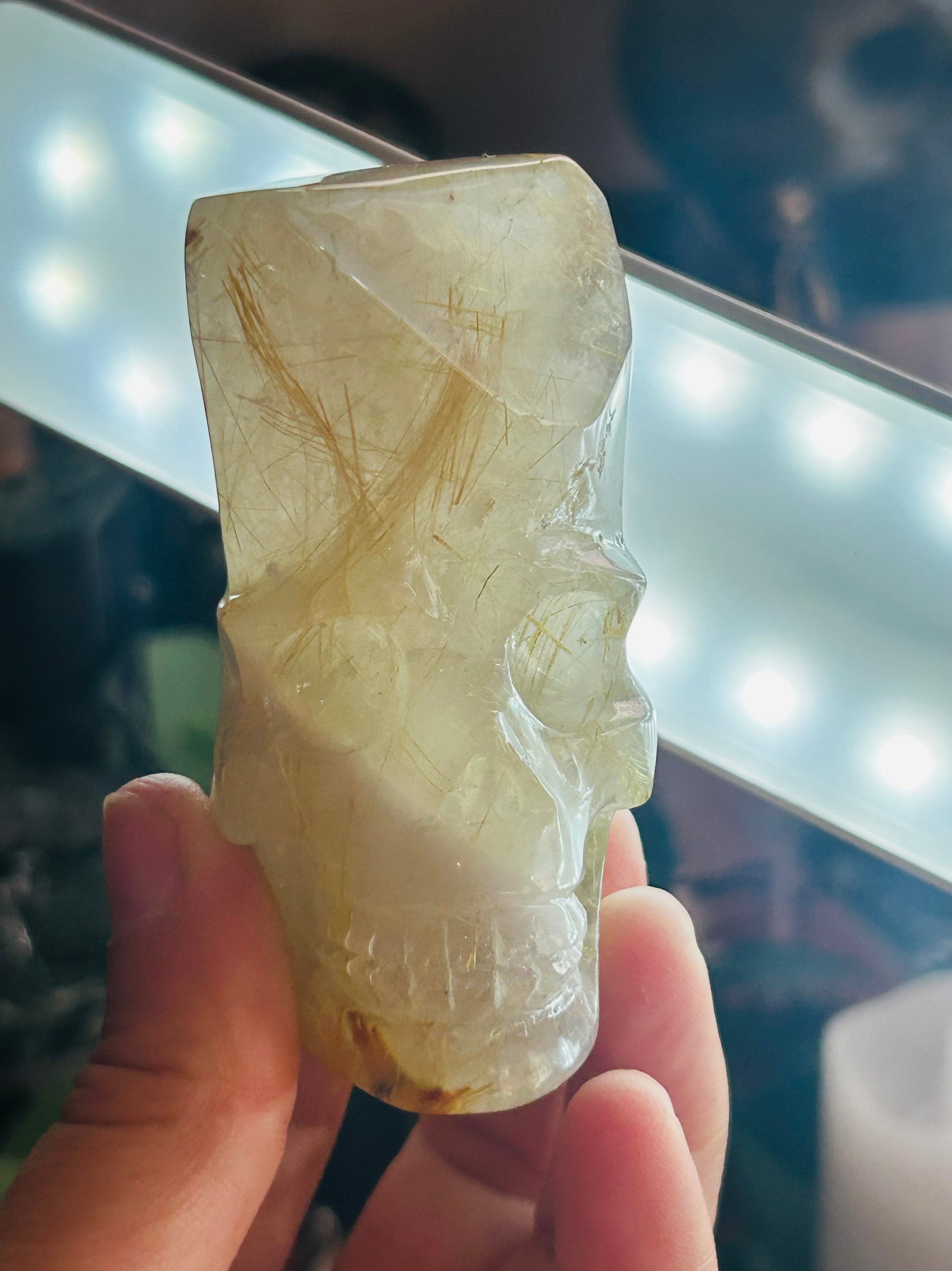 Gold rutilated quartz skull