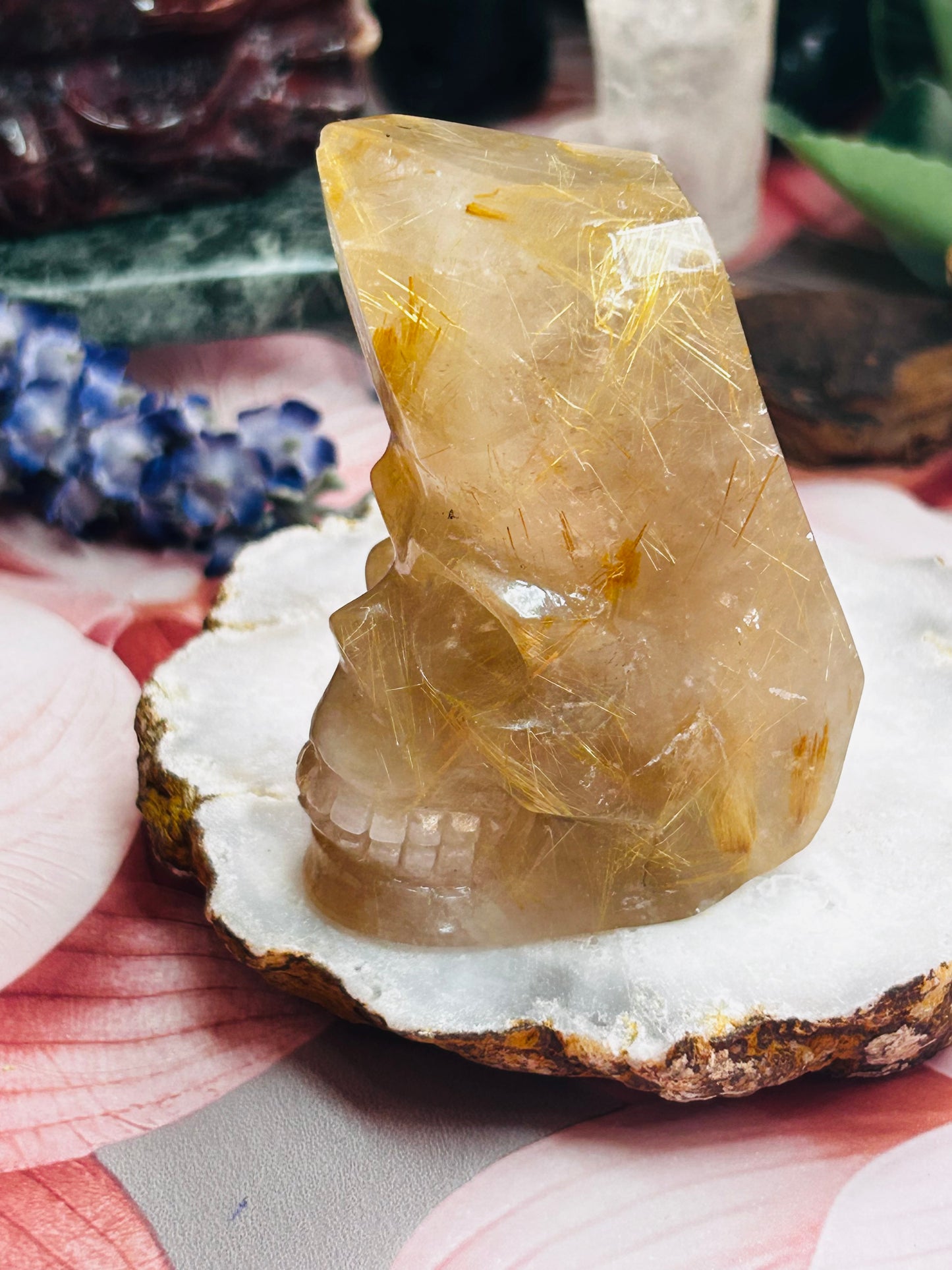 Gold rutilated quartz skull