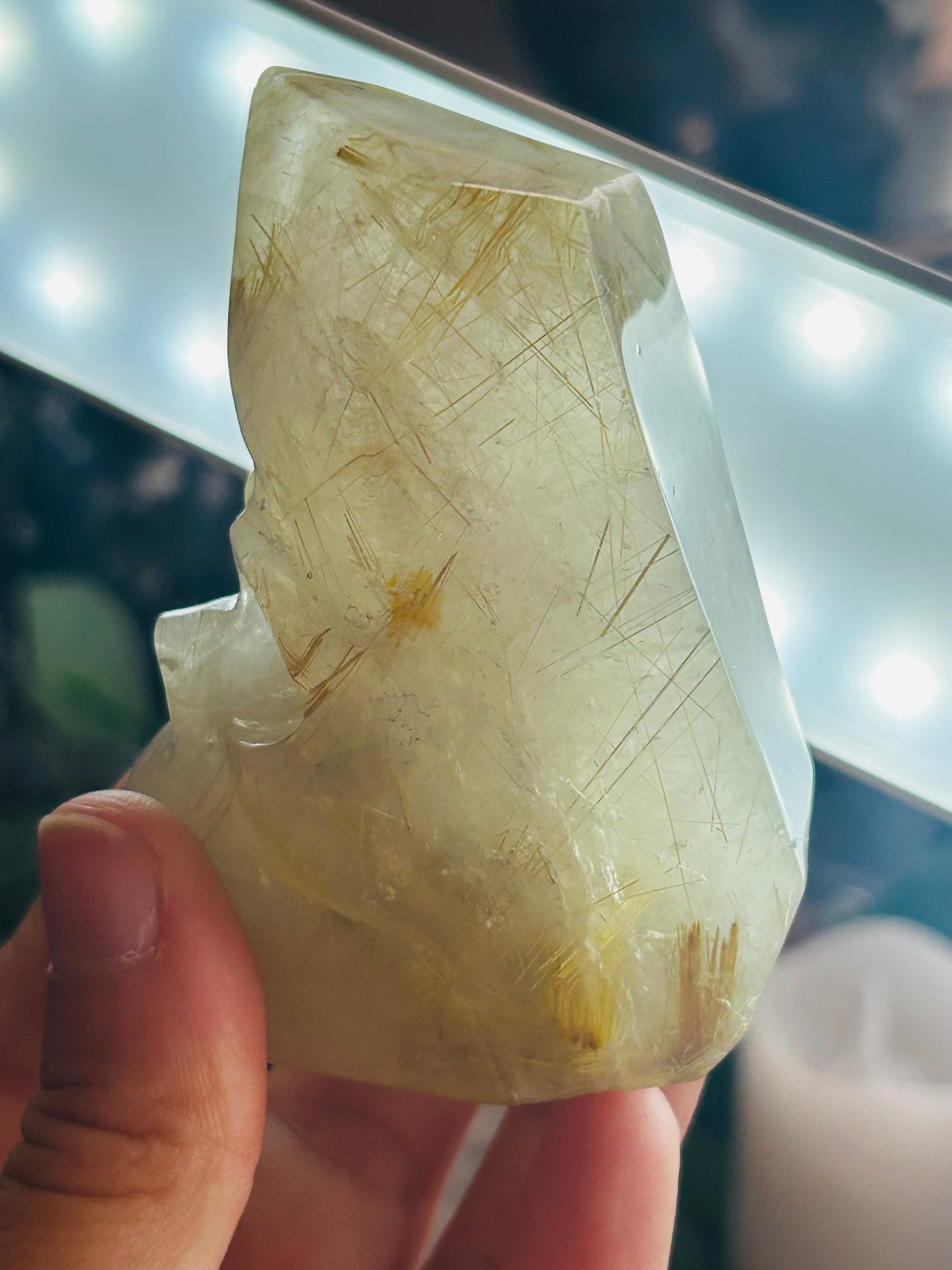 Gold rutilated quartz skull