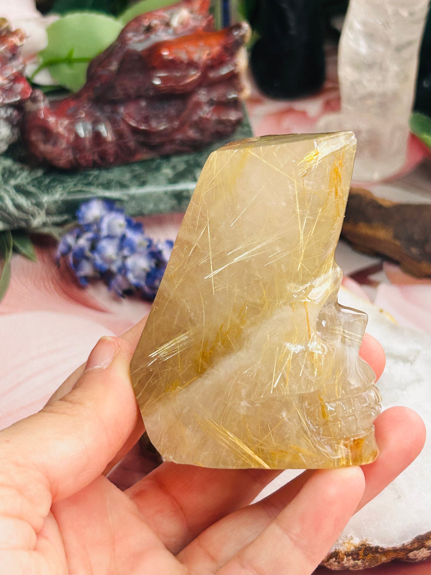 Gold rutilated quartz skull