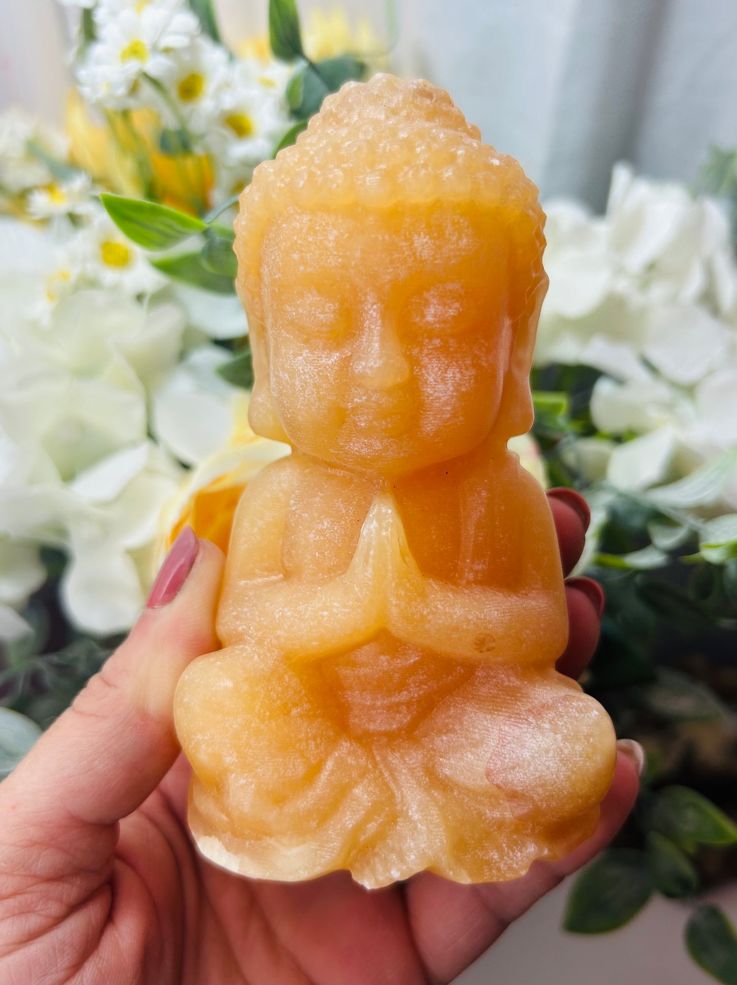 Orange calcite Buddha