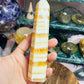 Orange calcite banded tower