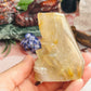 Gold rutilated quartz skull