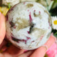 Pink tourmaline with smoky quartz sphere
