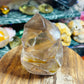 Smoky quartz with golden healer flame