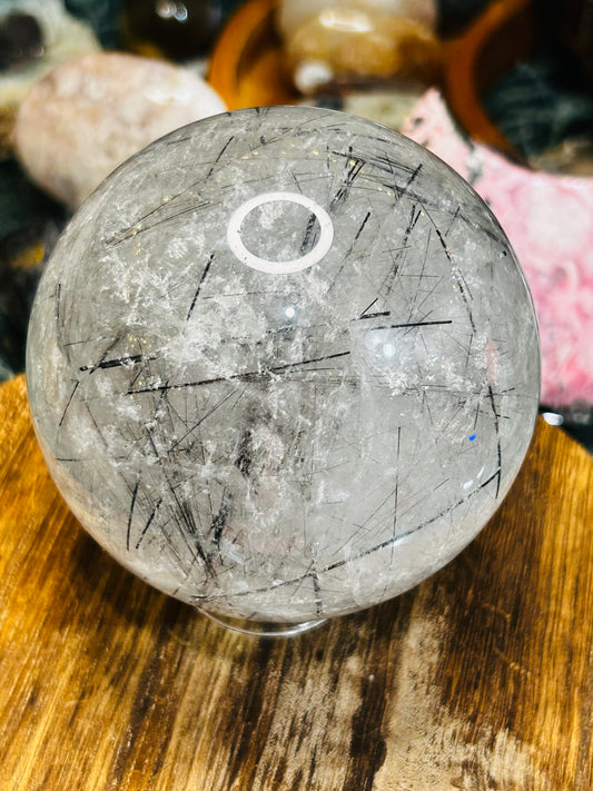 Black tourmaline in quartz sphere