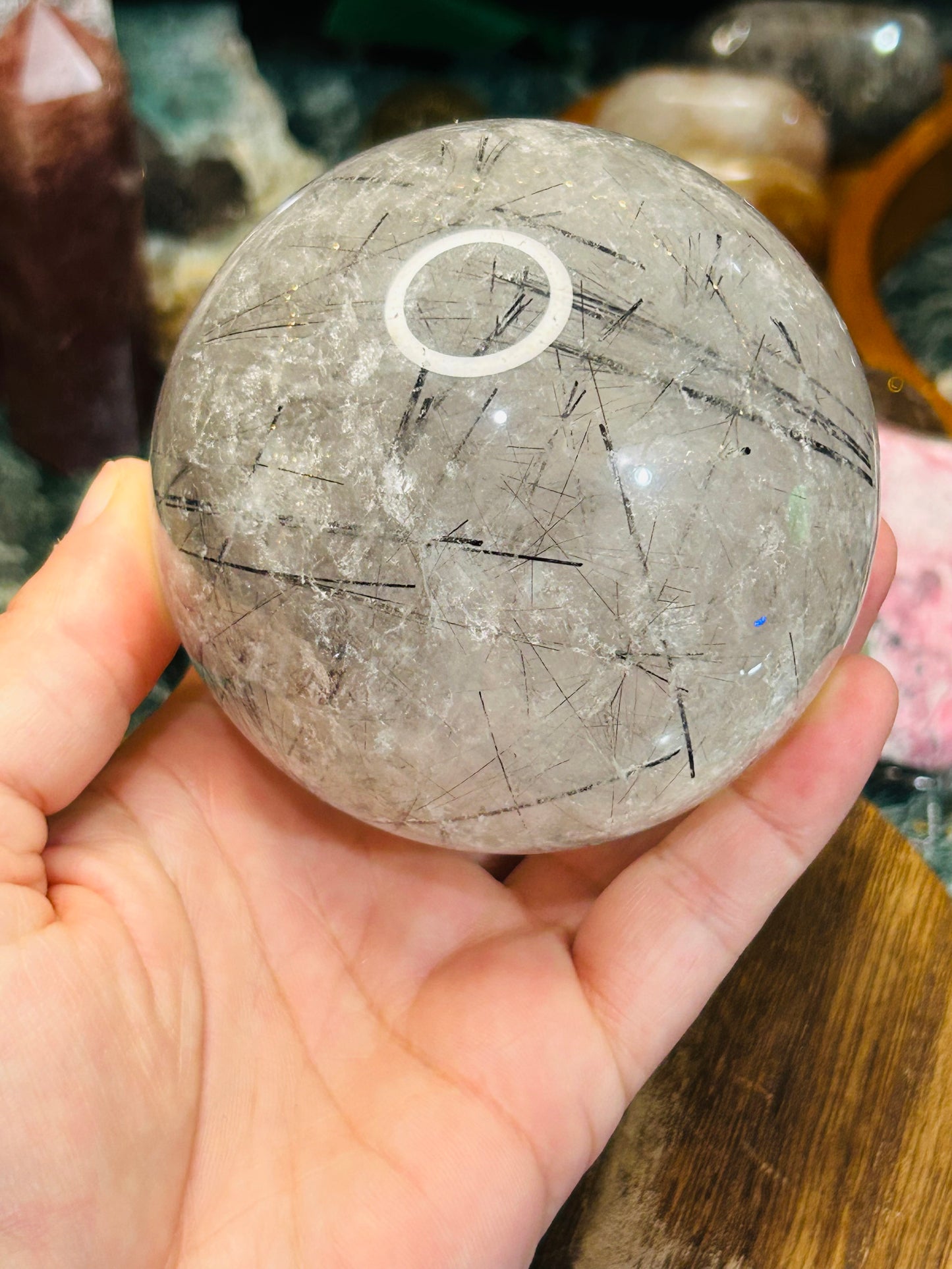 Black tourmaline in quartz sphere