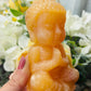 Orange calcite Buddha
