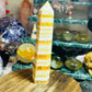 Orange calcite banded tower