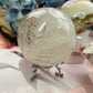 Smoky quartz with black tourmaline rutile sphere