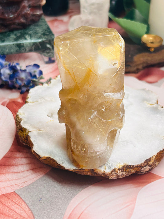 Gold rutilated quartz skull