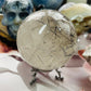 Smoky quartz with black tourmaline rutile sphere